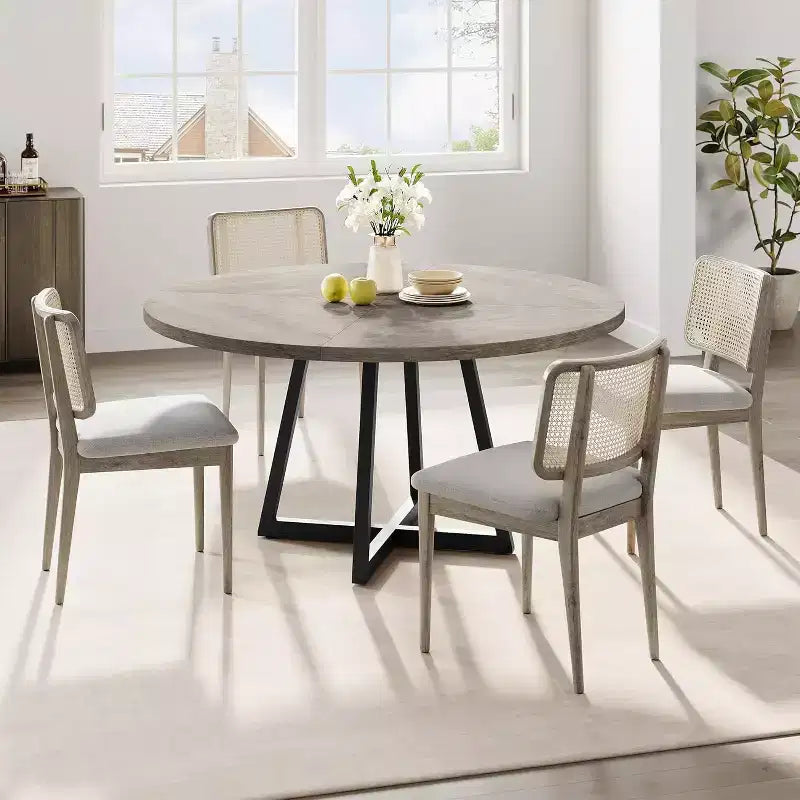 Tavolo da pranzo rotondo grigio, base in metallo incrociata, piano in MDF, 4 posti