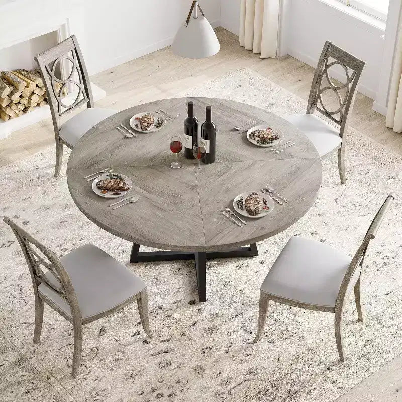 Tavolo da pranzo rotondo grigio, base in metallo incrociata, piano in MDF, 4 posti
